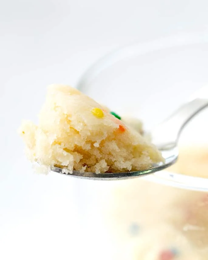 Closeup image of spoonful of vanilla mug cake