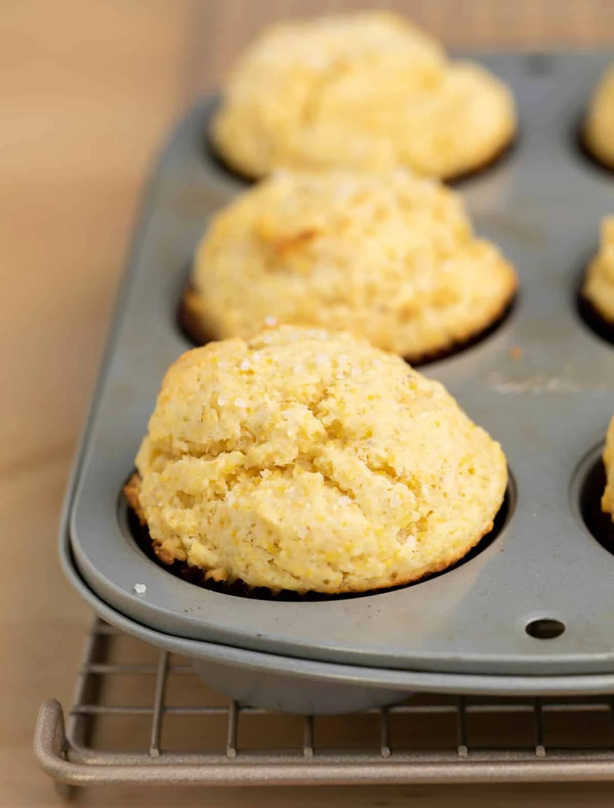 Closeup of corn muffins baked in muffin tin