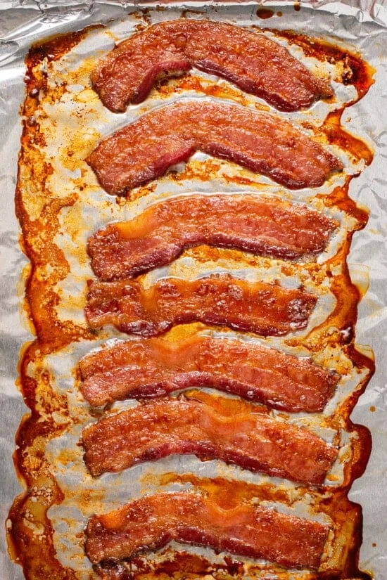 Cooked bacon on foil.