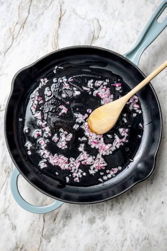 Cooking red onions in skillet with oil