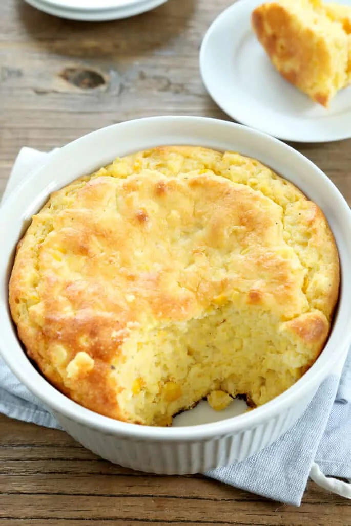 Cornmeal spoonbread in a round casserole dish