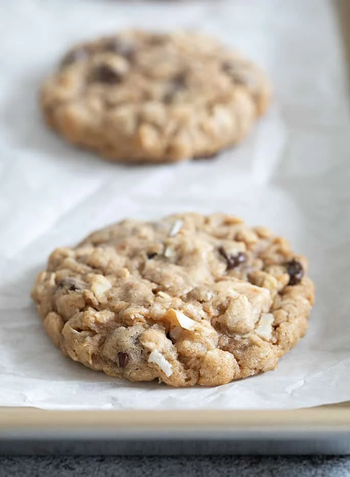 Cowboy cookies baked on white paper on tray