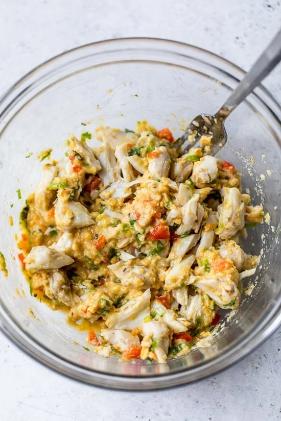 Crab cake ingredients combined in a bowl.