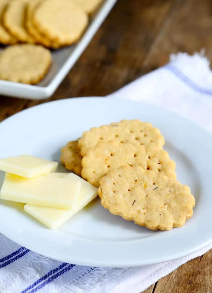 Crackers and cheese on a white plate 