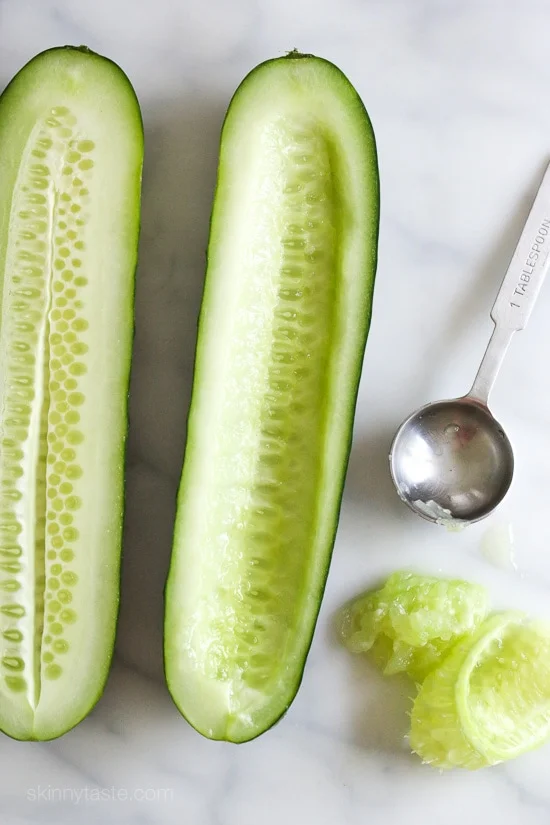 Cucumbers with the seeds scooped out and filled with hummus, avocado, tomatoes, onion and sprouts. So refreshing, healthy and light!