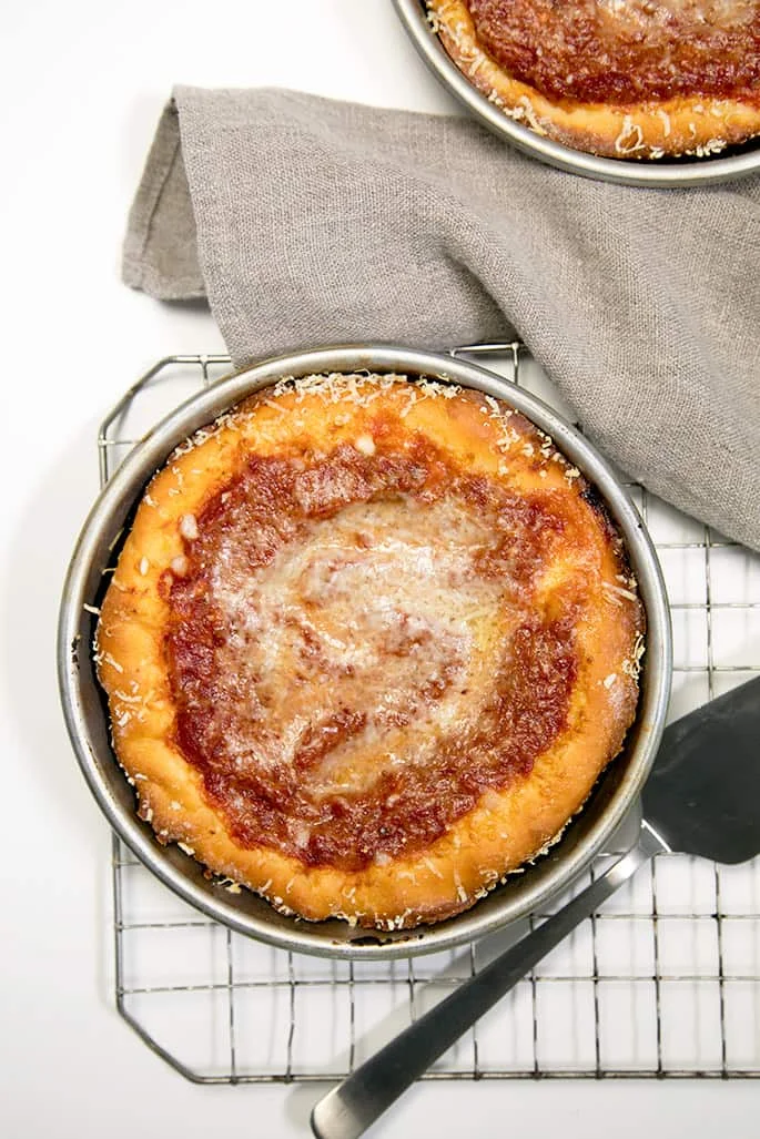 Deep dish gluten free pizza dough is so easy to make and tastes just like you remember. Load up your pizza with your favorite toppings!