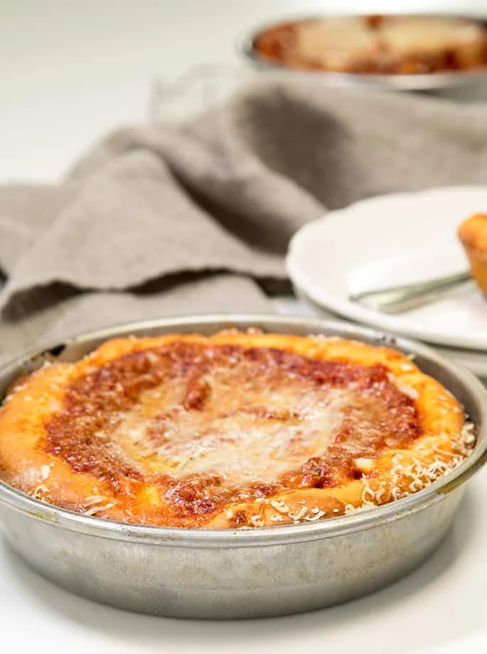 Deep dish gluten free pizza dough is so easy to make and tastes just like you remember. Load up your pizza with your favorite toppings!