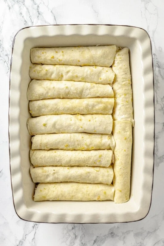 Enchiladas rolled in a baking dish