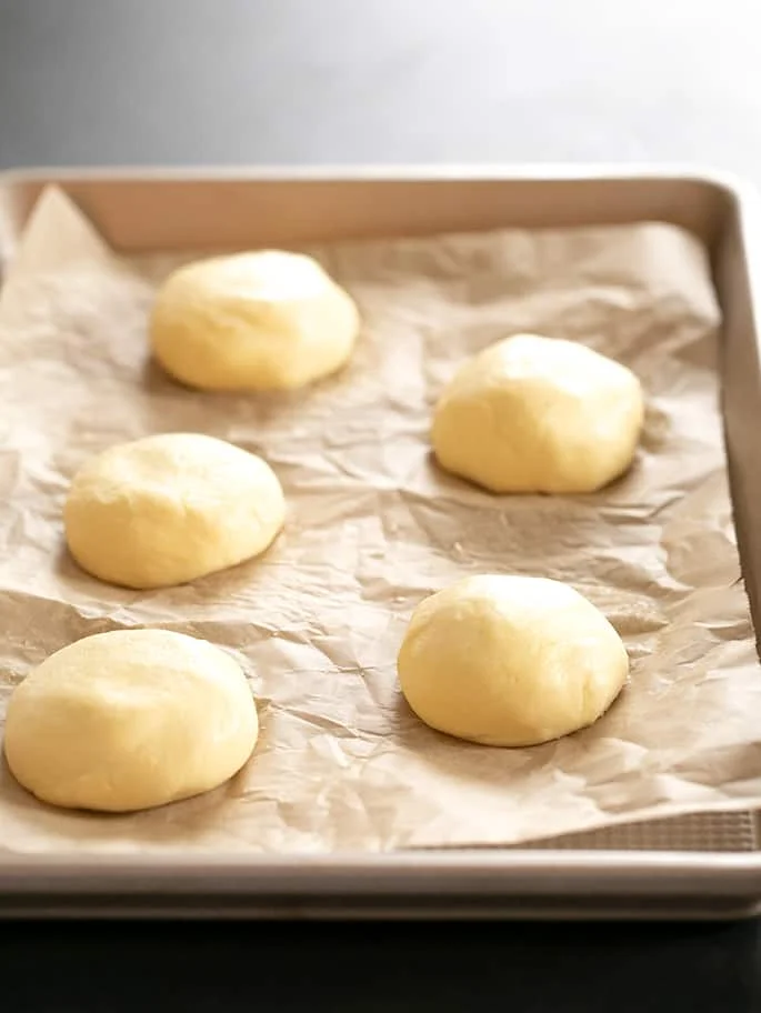 Five pieces of raw cheese bread.