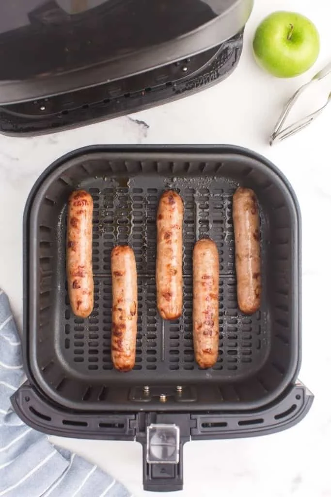 flip sausages halfway through cooking time for even crispiness