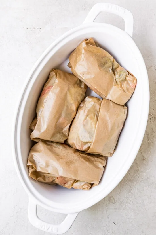 Fold the parchment and place on a baking dish.