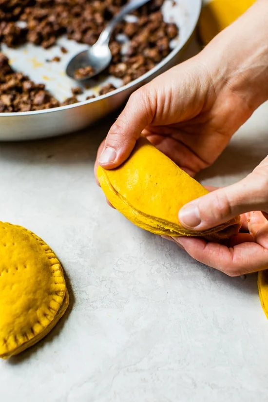 folding Jamaican Beef Patties before baking