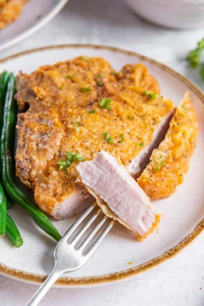 fork with a bite of pork