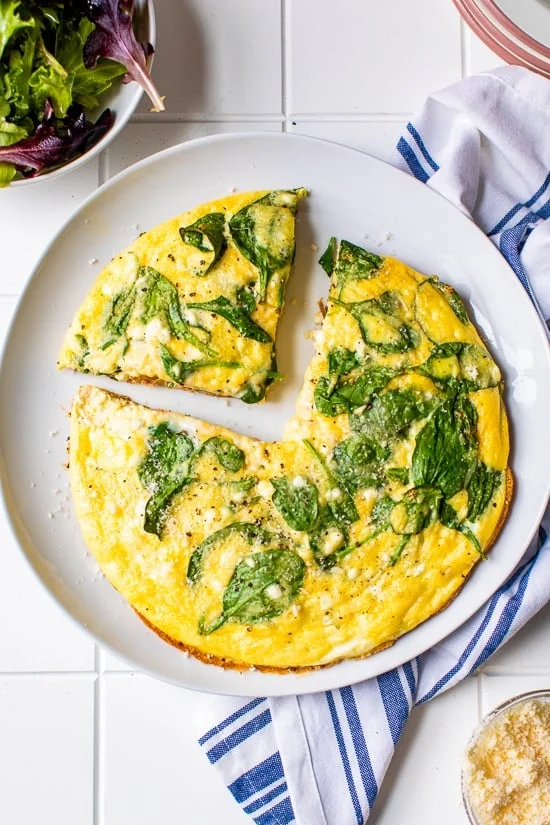 fritatta with a wedge cut out.