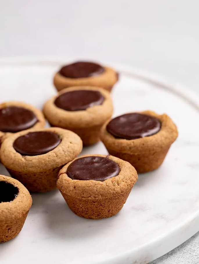 Fudge puddles on a round marble platter
