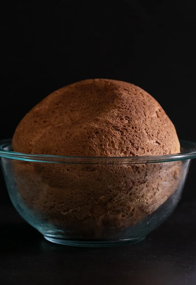 Gluten free artisan bread baked upside down in the bowl at the end of baking, for the perfect crust.