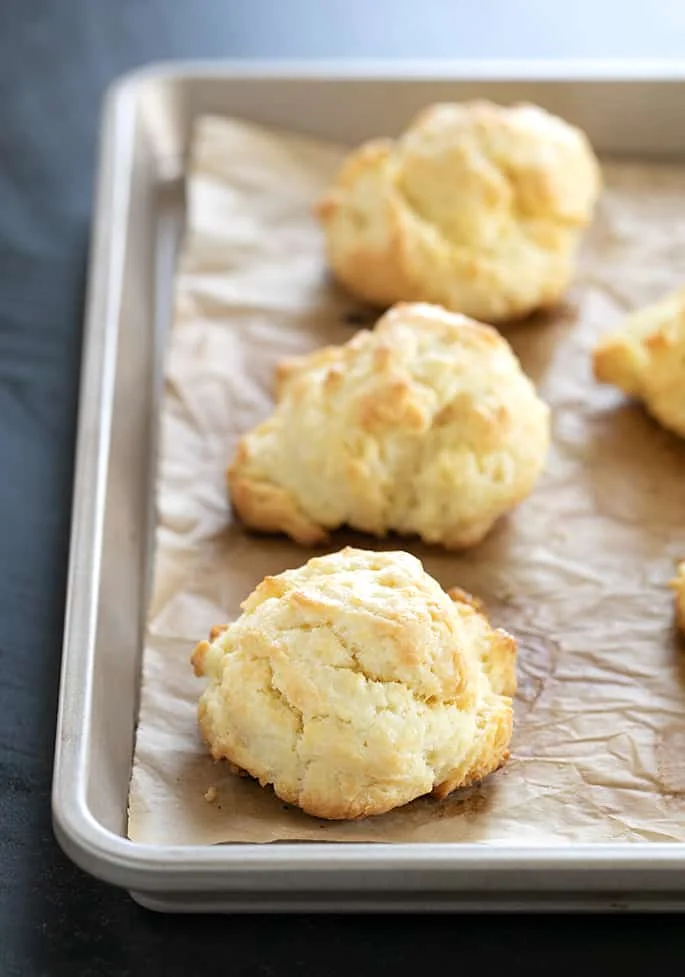 Gluten free cream biscuits just baked on a tray.