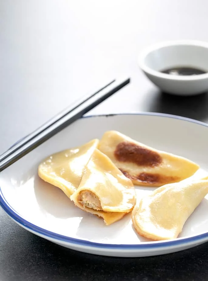 Gluten free potstickers on a plate, showing inside.
