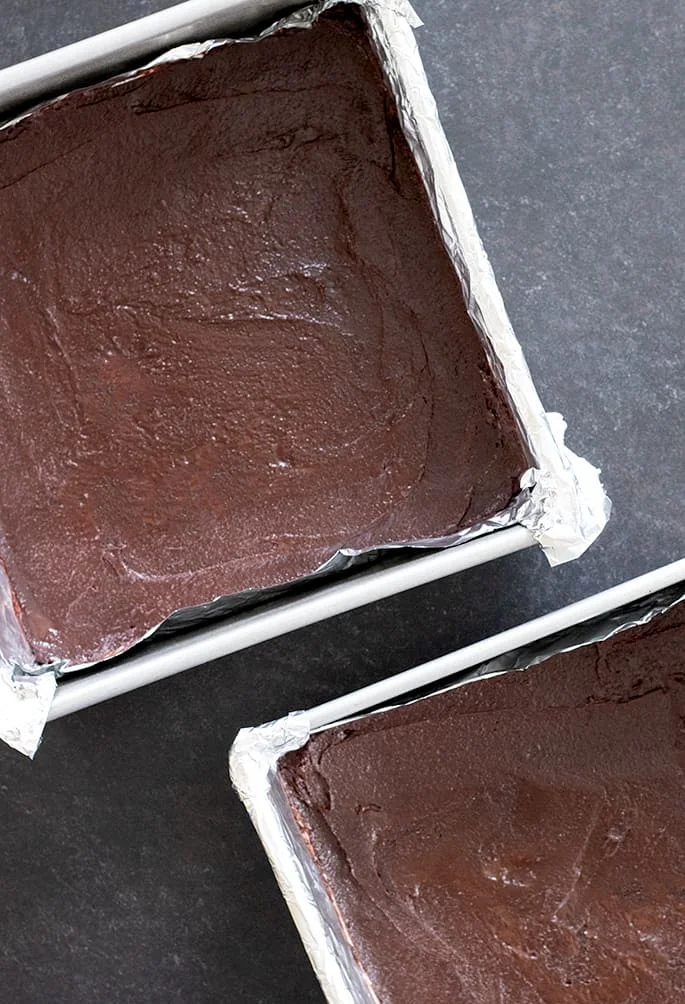 Grasshopper brownies raw in pans.