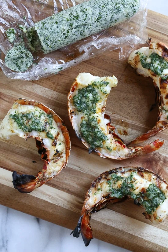 Grilled Lobster Tails topped with Herb Garlic Butter are a delicious delicacy, and grilling them is super quick and easy!
