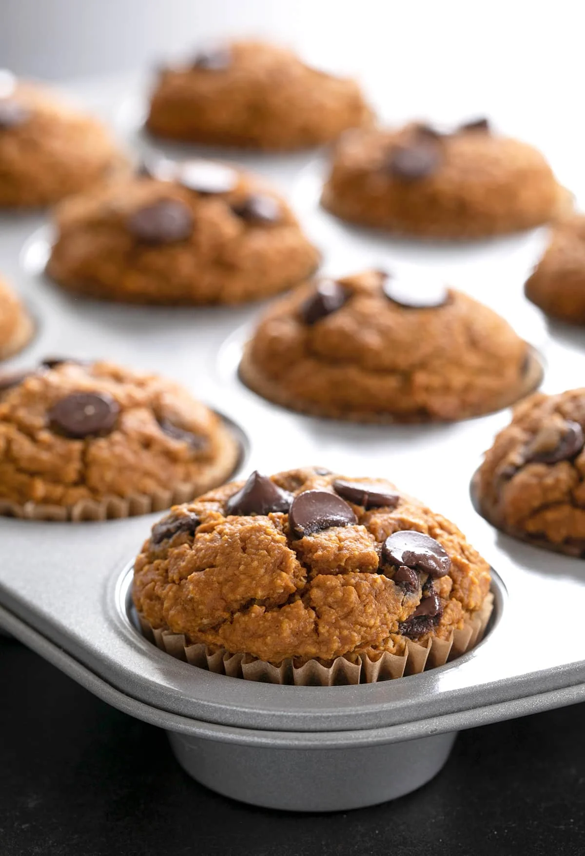 Healthy pumpkin muffins baked in muffin tin.