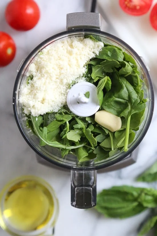 Ingredients for fresh basil pesto in food processor