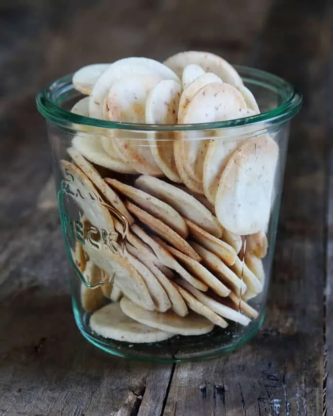 Jar of crackers on wooden surface