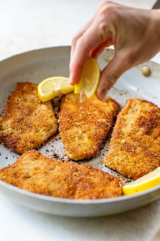 Lemon squeezed over turkey cutlets