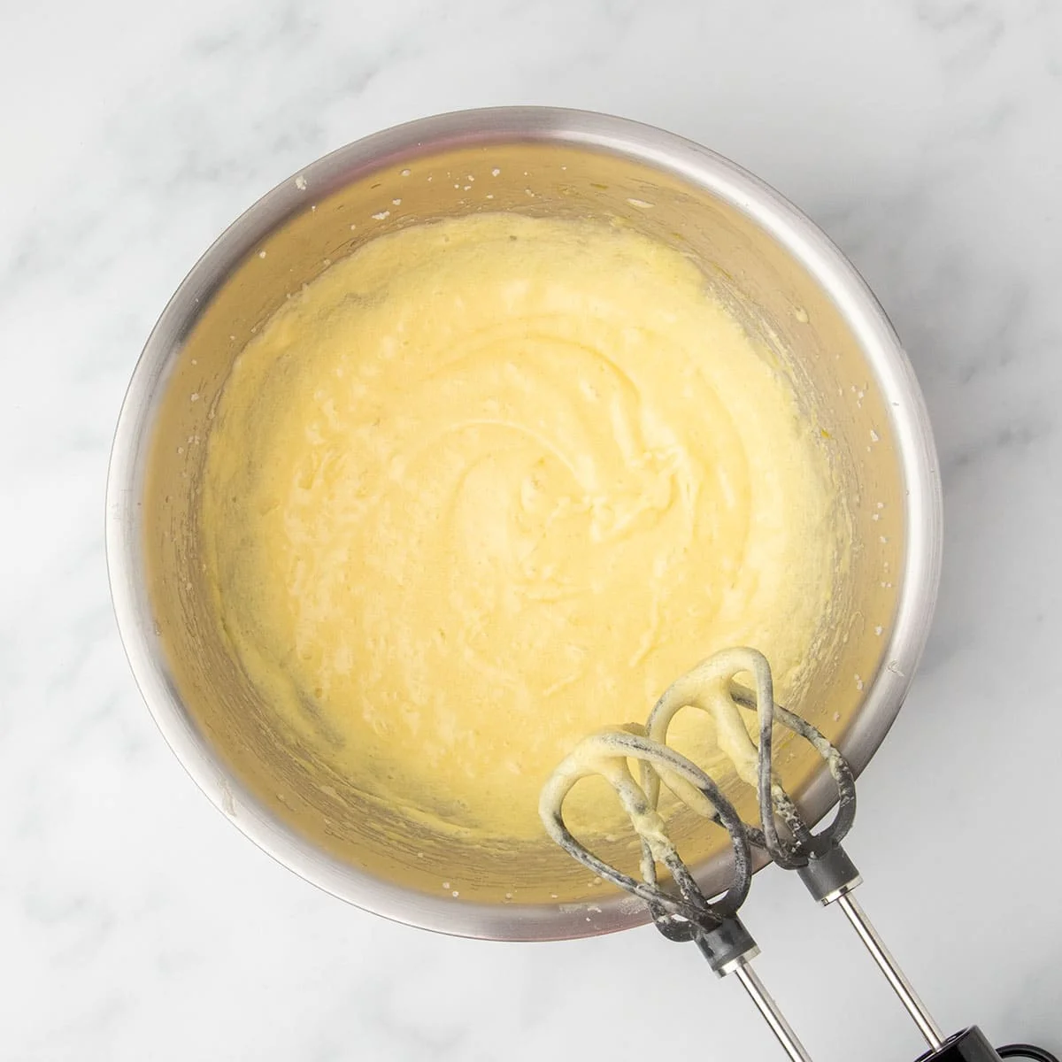 Light and airy batter after mixing eggs, butter, and sugar until fluffy