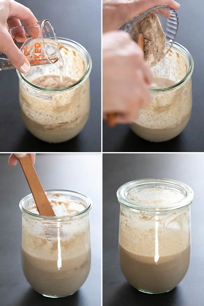 Light brown starter in glass jar being fed with spring water and gluten free flours, and then being mixed with a nonreactive spoon.