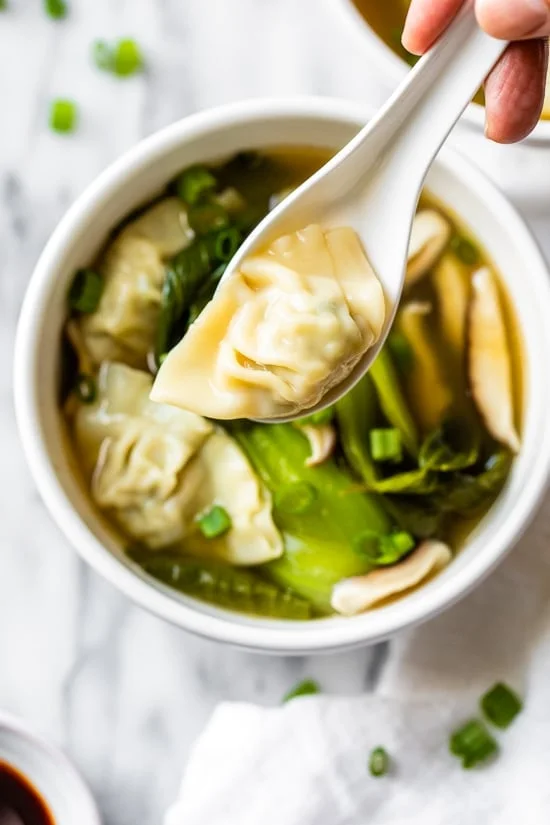 Loaded with vegetables, this quick and easy wonton soup is super simple, and takes under 15 minutes to make thanks to the frozen wontons.