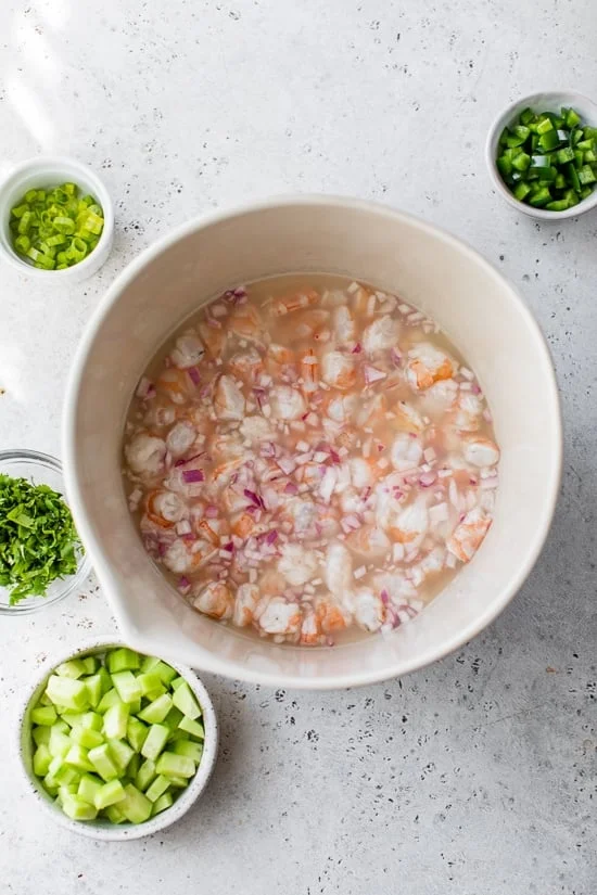 Marinate shrimp in lime juice.