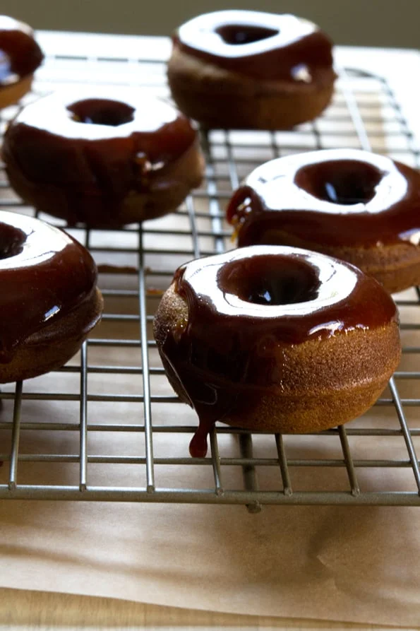 Miniature Paleo donut with glaze on a wire rack