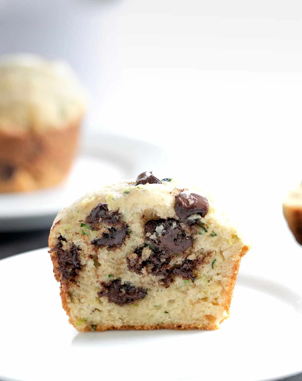 Muffin cut in half on a plate.