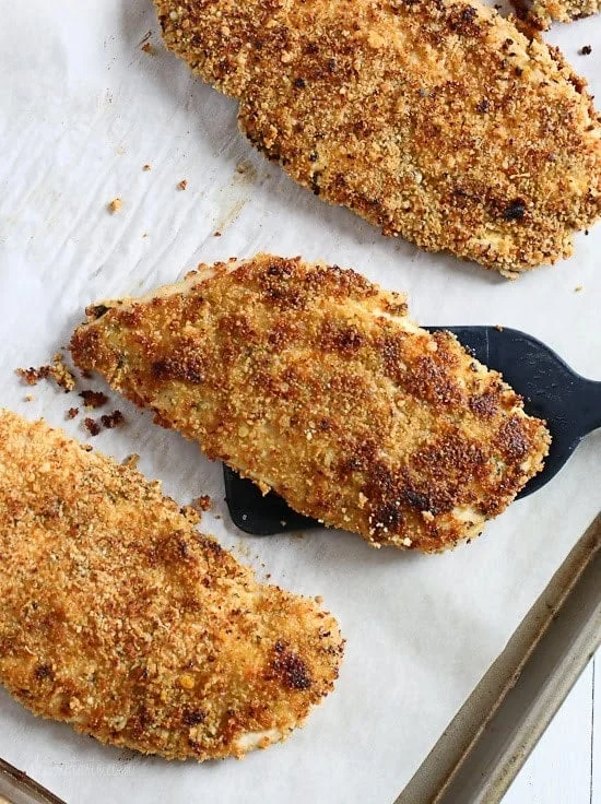Mustard Herb Crusted Chicken Breasts on a tray.
