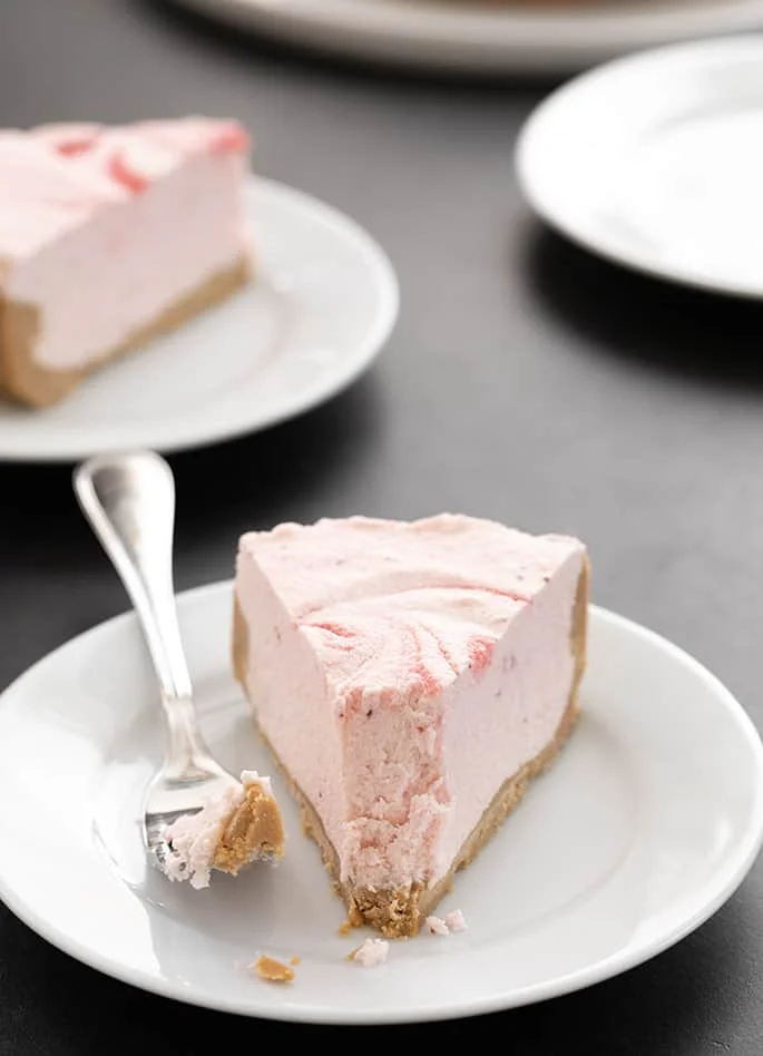 No bake strawberry yogurt pie slice with a bite taken