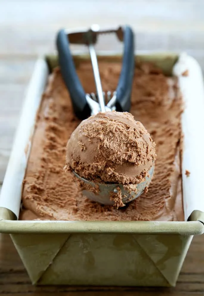 No churn chocolate gluten free ice cream made with only 4 simple ingredients, and no ice cream machine. It's so fast and easy, and it tastes like chocolate mousse!
