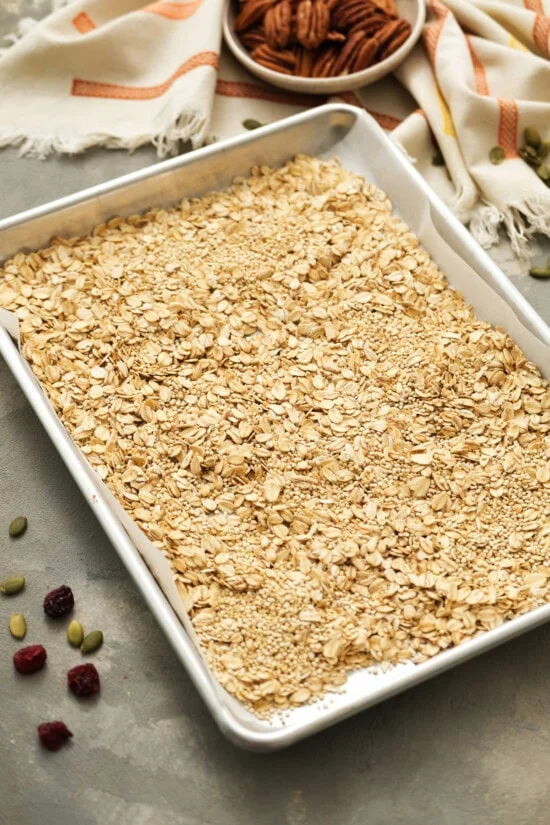 Oats on a sheet pan to make granola
