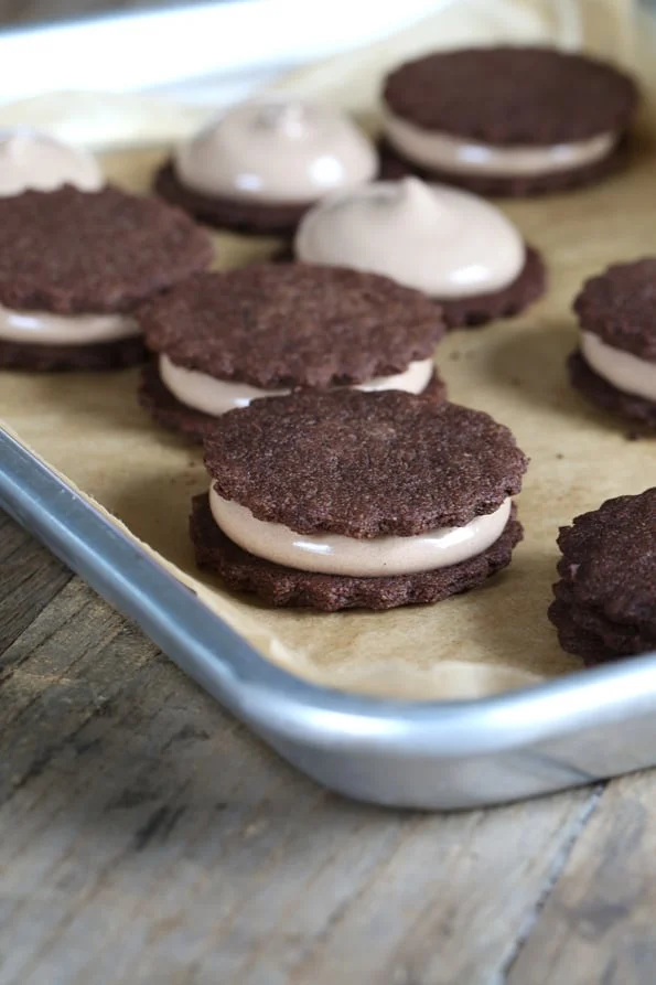 Oreo style cookies with filling on metal tray