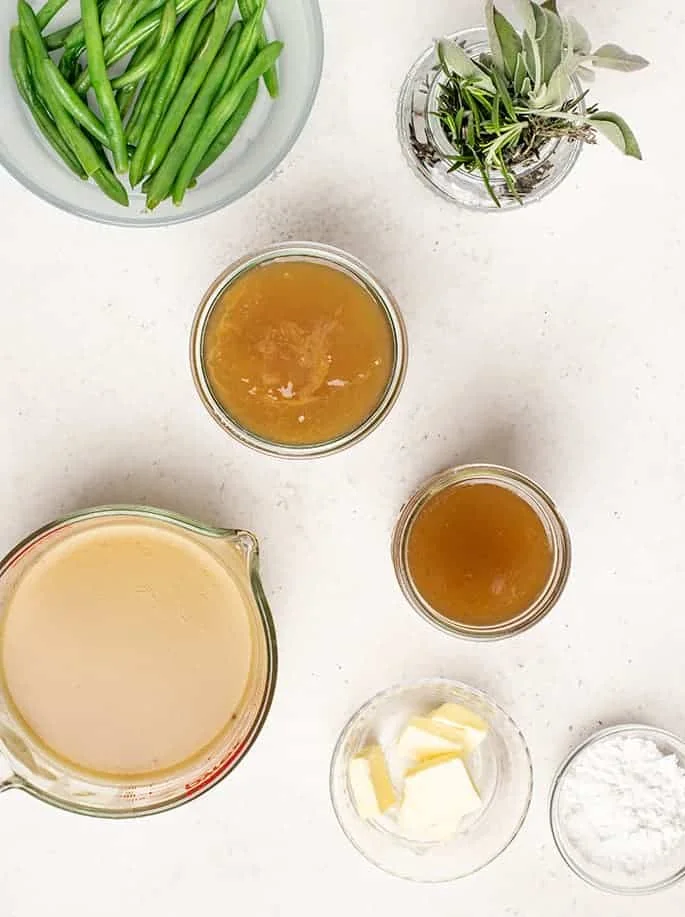 Overhead image of ingredients to make gravy in glass jars. 
