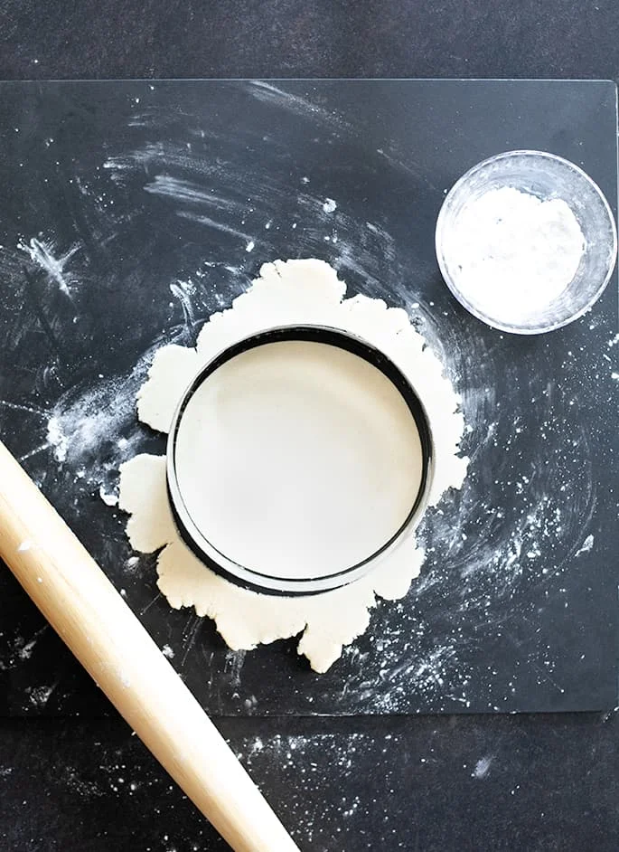 Overhead image of Paleo tortillas being cut with a large round cutter