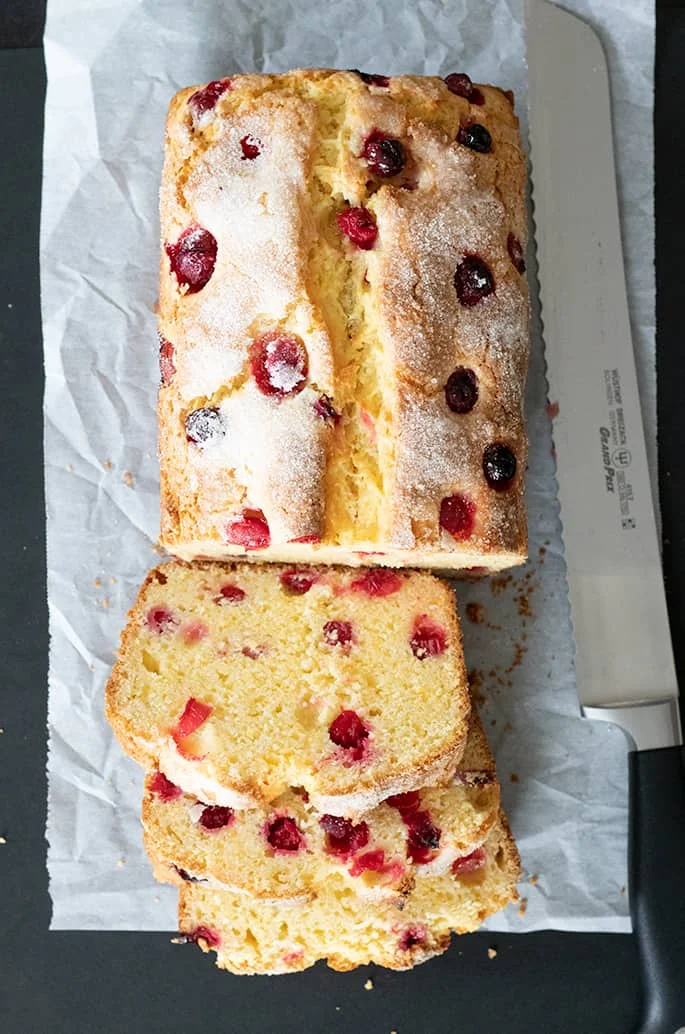 Overhead image of partially sliced gluten free cranberry cornbread.