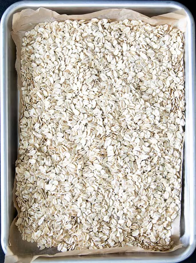 Overhead image of raw oats on a tray