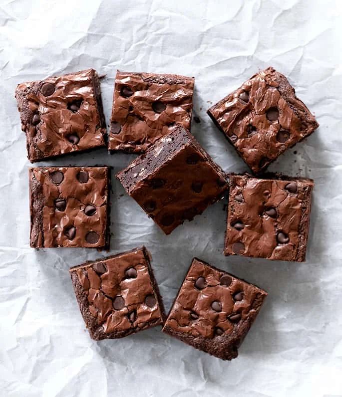 Overhead image of sliced brownies with one on its side