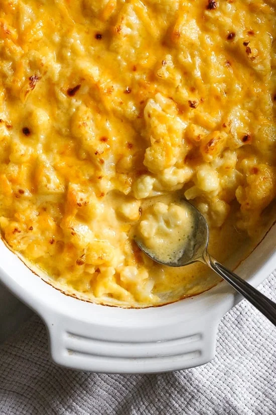 Overhead view of a baking dish of cauliflower mac and cheese.