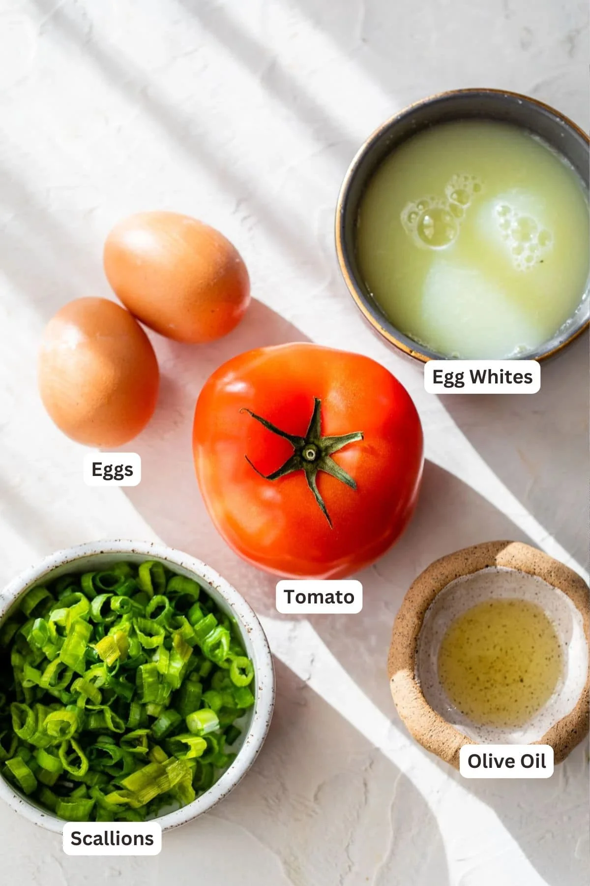 Overhead view of ingredients for huevos pericos