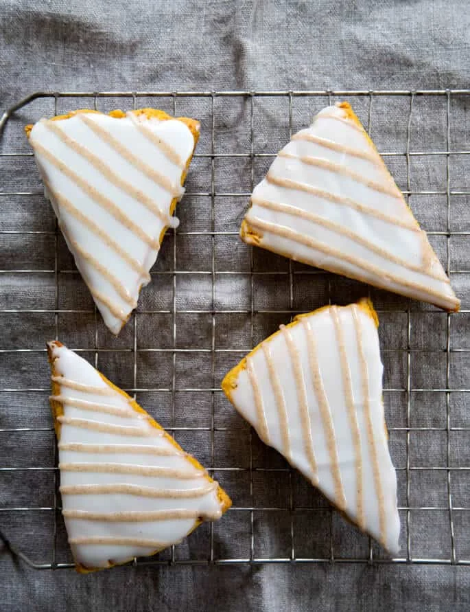 Overhead view of pumpkin scones on metal tray