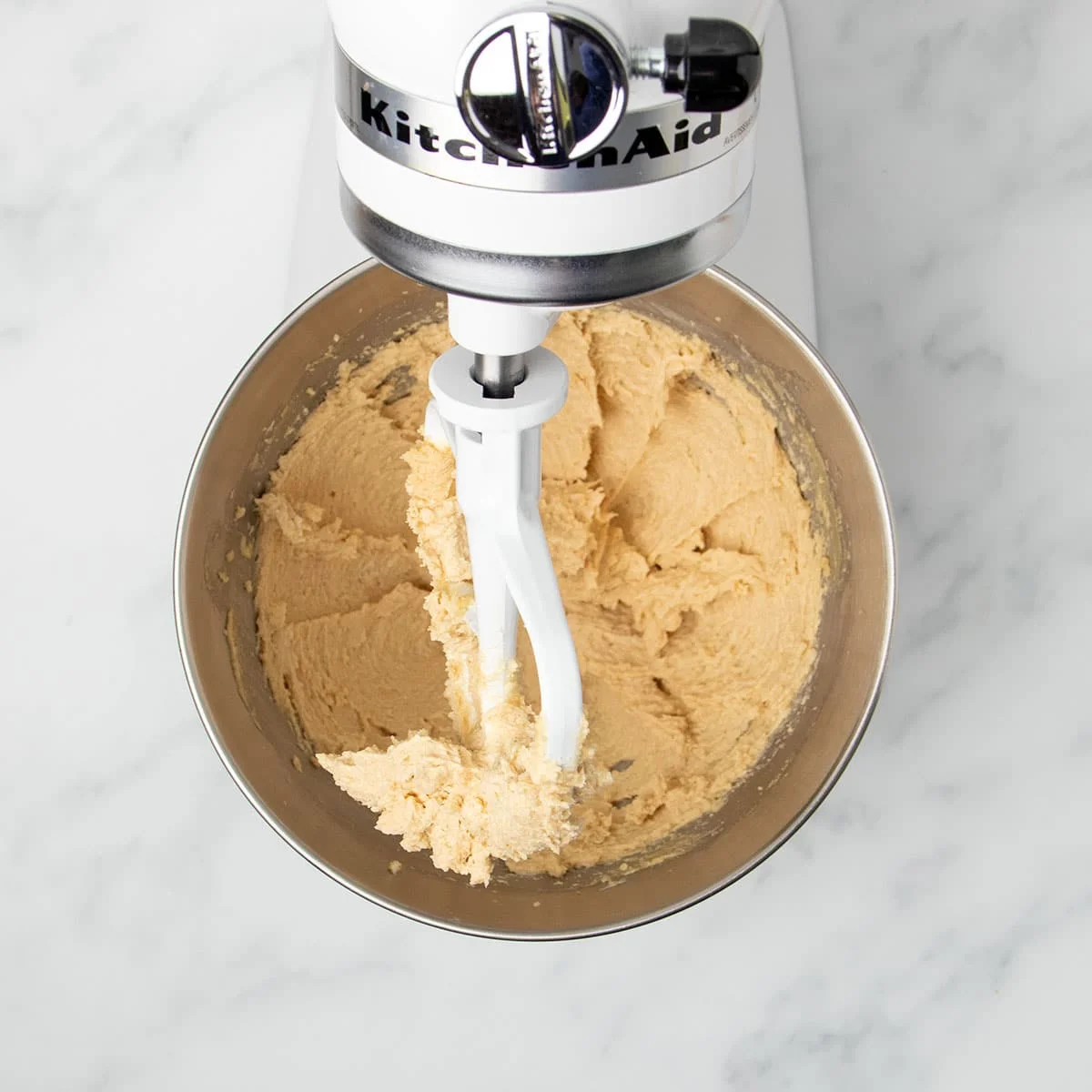 pale brown soft beaten butter and brown sugar in same mixing bowl with white flat beater