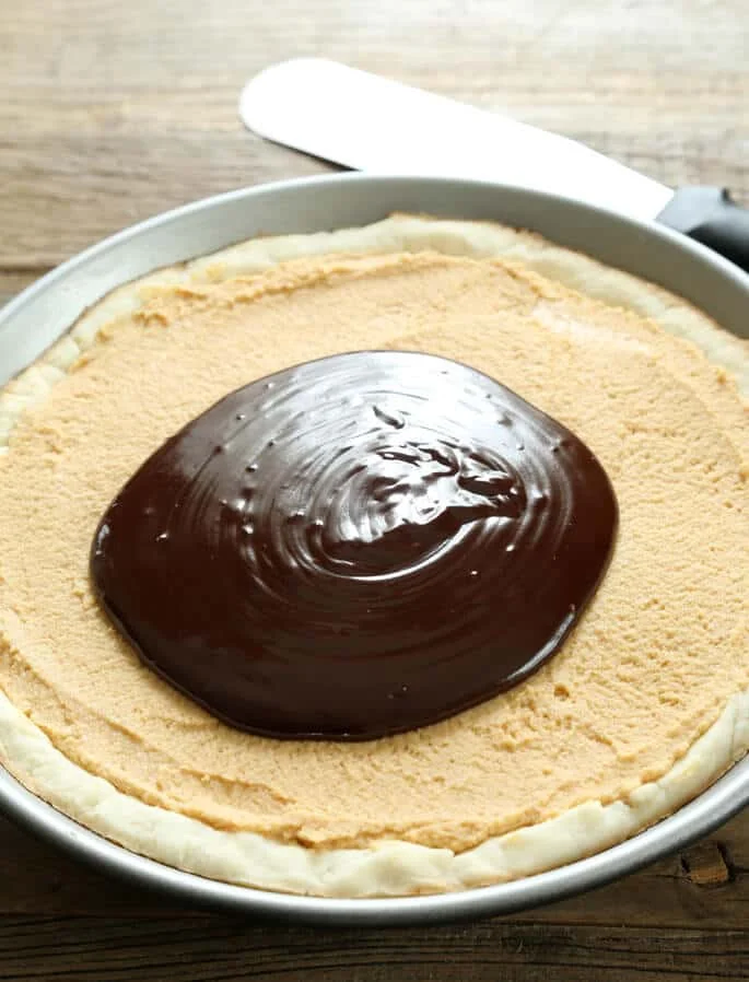 Peanut butter pie in metal circle shaped dish 