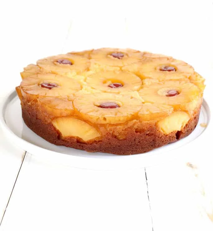 Pineapple upside down cake on a white plate 